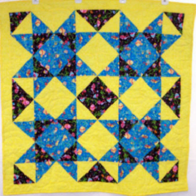 Child�s Quilt. Large stars. Top & backing are constructed using quality 100% cotton, batting is low loft polyester. Machine pieced and machine quilted by Linda Monasky <br />